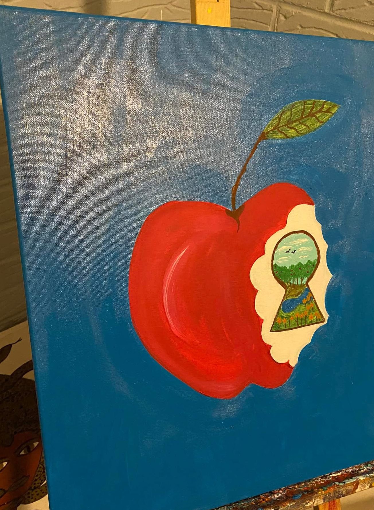 Detail of The Mega Bite, an apple opening onto a small window of sky
